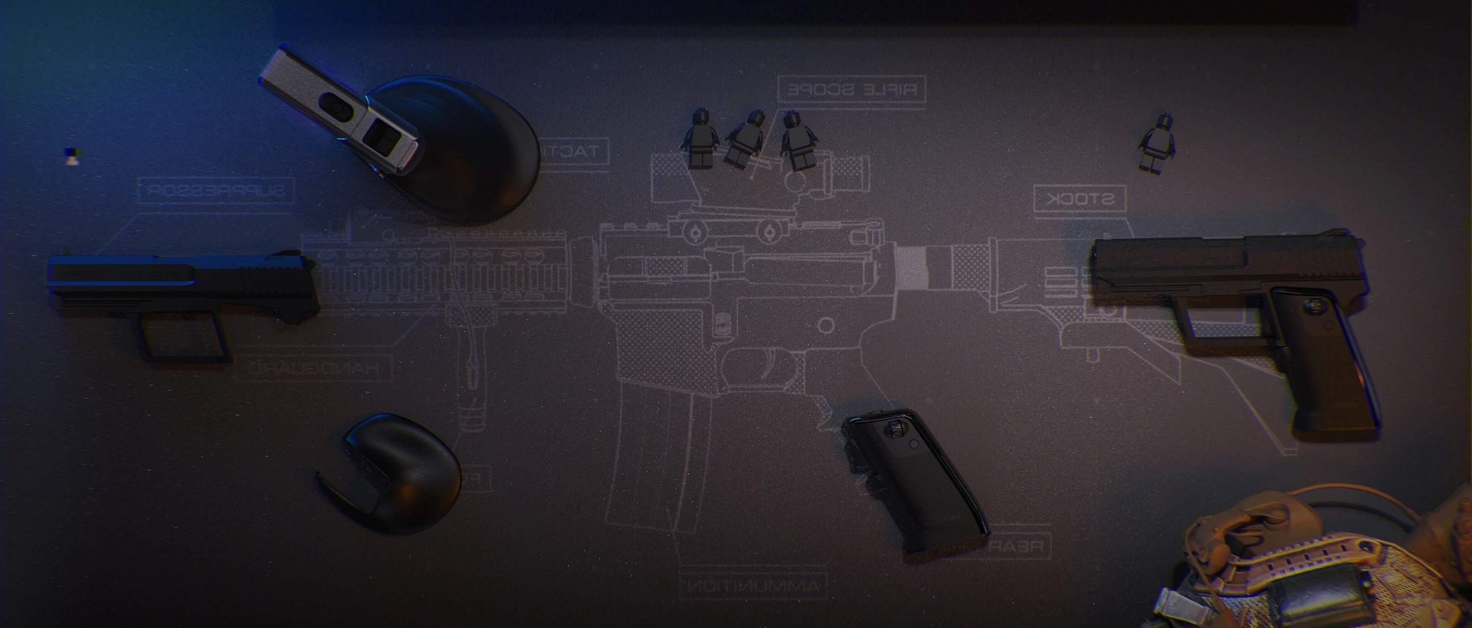 Ergonomic gun-style gaming mouse from RAGNOK showcased on a tactical desk mat.