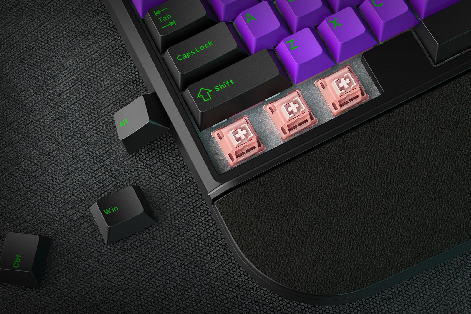 Close-up of a mechanical keyboard with RGB lighting on a dark surface